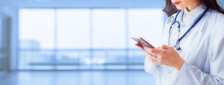 Medicine. Female Doctor in the Hospital faceless background.の写真素材