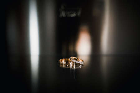 wedding rings on a steel dark backgroundの写真素材