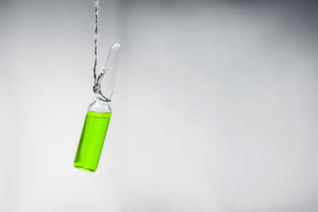 death penalty concept. The ampoule is suspended on a suicide loop. euthanasia with the help of chemicals. Yes or no low key photoの写真素材