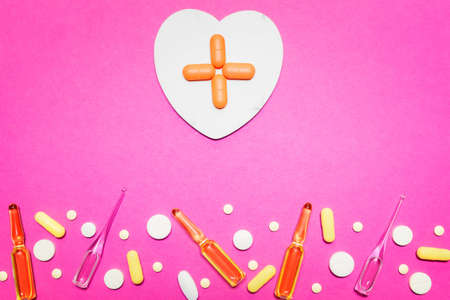 pharmaceutical medical pink background. Top view of the pills, ampoules, pills. Place for text