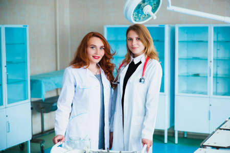 Medical students profession staff. multinational people - doctor, nurse and surgeon. A group of graduates of a medical university in a surgical room. Nursing Schoolの写真素材