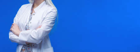 Female Doctor With Stethoscope in blue background.の写真素材