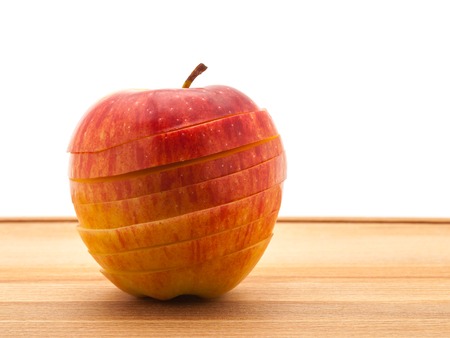 A delicious juicy apple for baking on a wooden table.