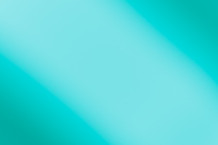 Blurred background of blue color. Diagonal darkening left and right. No texture.の写真素材