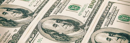 Denominations of one hundred dollars are arranged in a row. Processing under the antiquity. View at...
