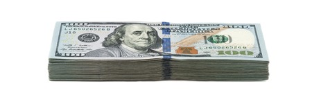 Ten thousand dollars in a pack of one hundred dollars. View at an angle. Isolated.