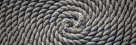The rope for the boat laid in the form of a spiral. Backgroundの写真素材