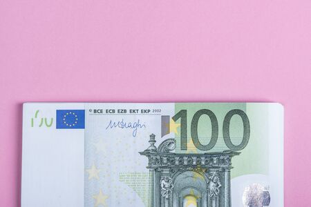 Euro cash on a lilac, purple and pink background. Euro Money Banknotes. Euro Money. Euro bill. Place for textの写真素材