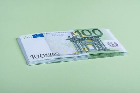 Euro cash on a green background. Euro Money Banknotes. Euro Money. Euro bill. Place for textの写真素材