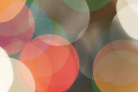 Colourful festive multi-colored circles . Defocused abstract multicolored bokeh lights backgroundの写真素材