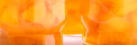 Apricot jam in glass jars in the sunlight