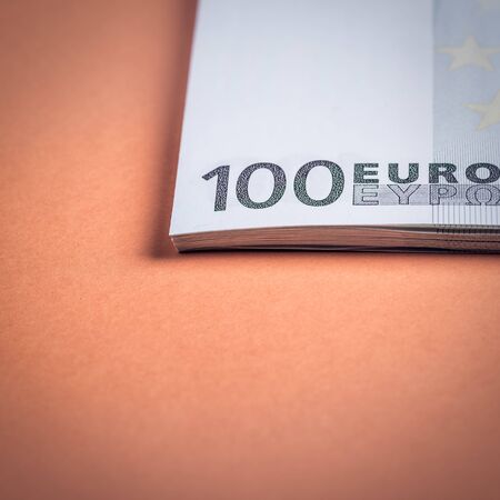 Euro cash on a pink and orange background. Euro Money Banknotes. Euro Money. Euro bill. Place for textの写真素材