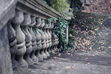 Balusters made of stone on the old historic staircase