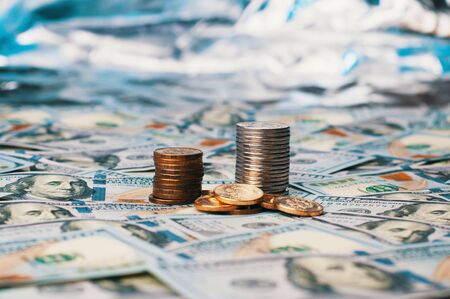 Cash hundred dollar bills, dollar background image. A stack of one hundred American bills and coins