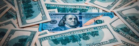 Cash of hundred dollar bills, dollar background image. A pile of one hundred US banknotes