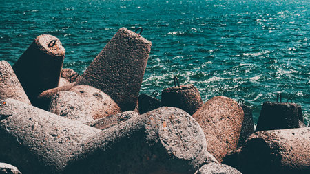 Concrete barrage prevents waves in the seaportの写真素材