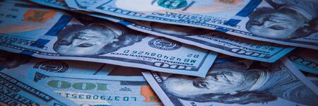 The background of a one hundred dollar bill. Style blue light