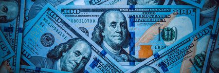 The background of a one hundred dollar bill. Style blue light