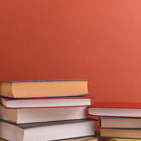Stacks of books several on a brown background close-up. Back to school, education, learning,の写真素材