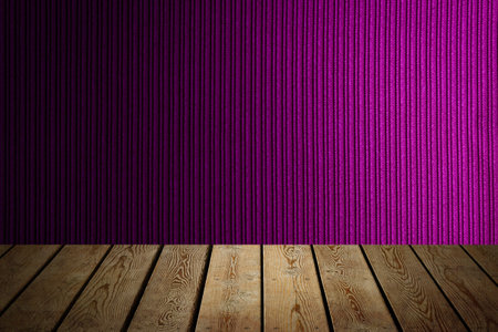 The background is blank wooden boards and a textured striped wall with gradient lighting and vignetting.の写真素材