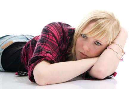 Beautiful teenage girl dreaming. Isolated on whiteの写真素材