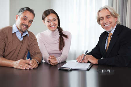 Financial advisor in meeting with a young couple