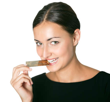 Shopaholic - holding a credit card in mouthの写真素材