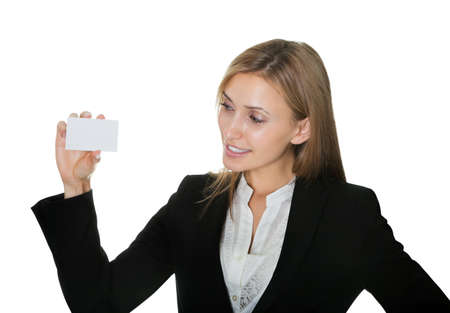 Pretty young businesswoman with a blank cardの写真素材