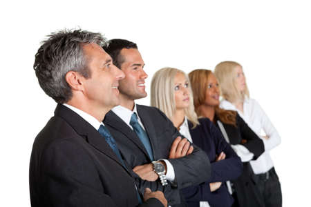 Happy team of business colleagues standing together with hands folded looking away