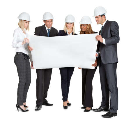 Group of experienced architects studying blueprints on white backgroundの写真素材