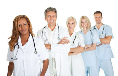 Friendly team of doctors smiling over white backgroundの写真素材