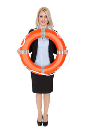Beautiful businesswoman with life buoy. Isolated on whiteの写真素材