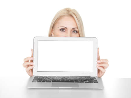 Business woman presenting laptop. Isolated on whiteの写真素材
