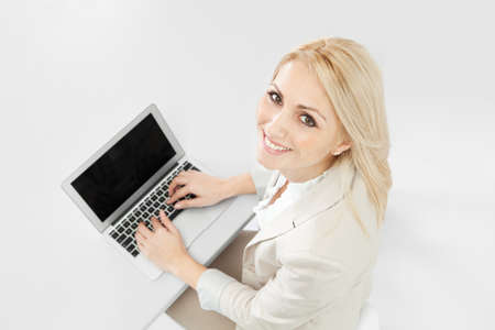 Beautiful businesswoman working on computer in the officeの写真素材