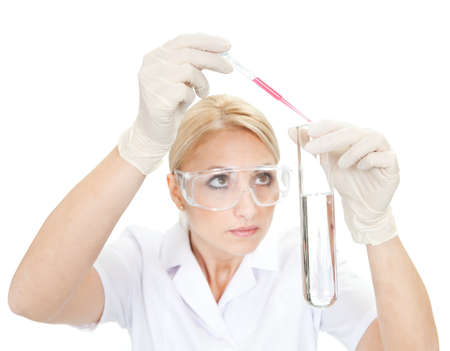 Researcher mixing liquids inside the tube in laboratoryの写真素材