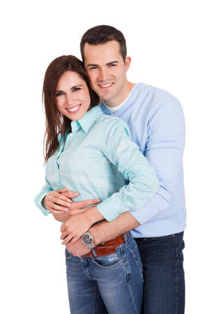 Portrait of beautiful young couple. Isolated on whiteの写真素材