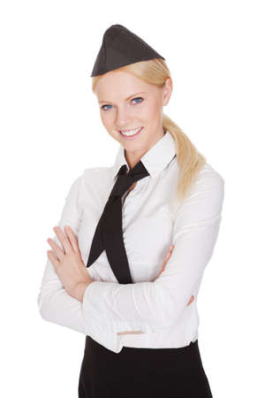 Portrait of beautiful young stewardess. Isolated on whiteの写真素材