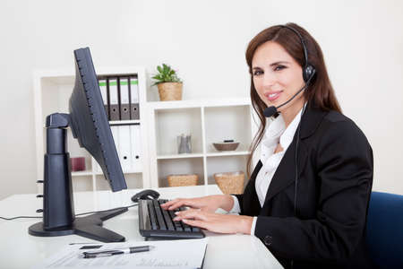 Young Cheerful Smiling Support Phone Female Operator In Headset At Office.