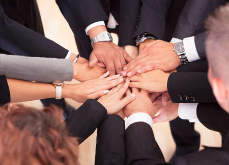Group Of Business People With Their Hands Together