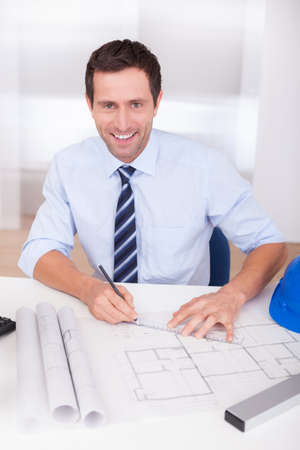Portrait Of Architect With Blueprint In The Officeの写真素材