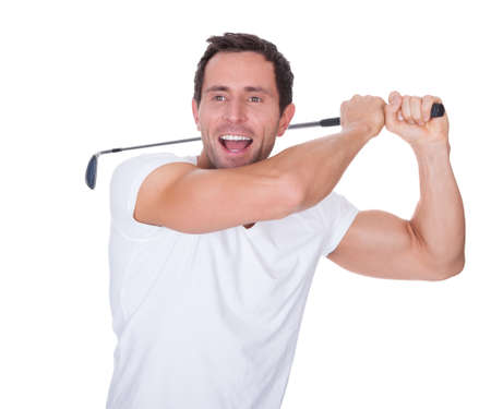 Golfer After Swing Isolated On A White Backgroundの写真素材