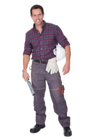 Young Man Holding A Roll Of Blueprints On White Backgroundの写真素材