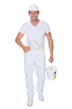 Painter Holding A Paint Roller And Bucket On White Backgroundの写真素材