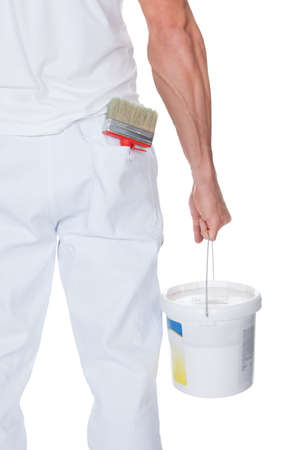 Painter Holding A Paint Roller And Bucket On White Backgroundの写真素材