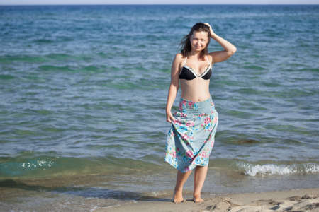 Beautiful young woman at the beach at Mediterranean Seaの写真素材