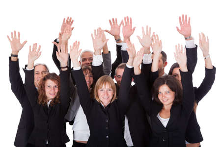 High angle view of a diverse group of business people waving in acknowledgment of an accolade isolated on whiteの写真素材