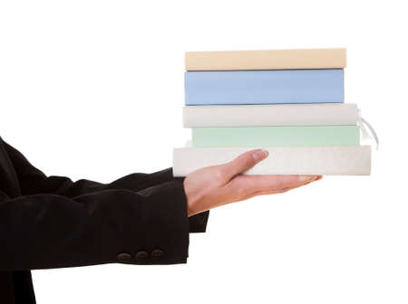 Woman holding stack of books. Isolated on whiteの写真素材