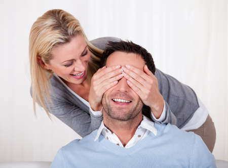 Affectionate couple relaxing on a sofa at home