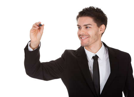 Businessman drawing on the screen. Isolated on whiteの写真素材