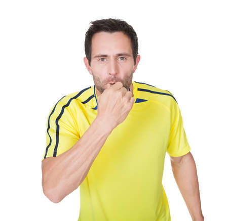 Soccer judge whistling. Isolated on white backgroundの写真素材